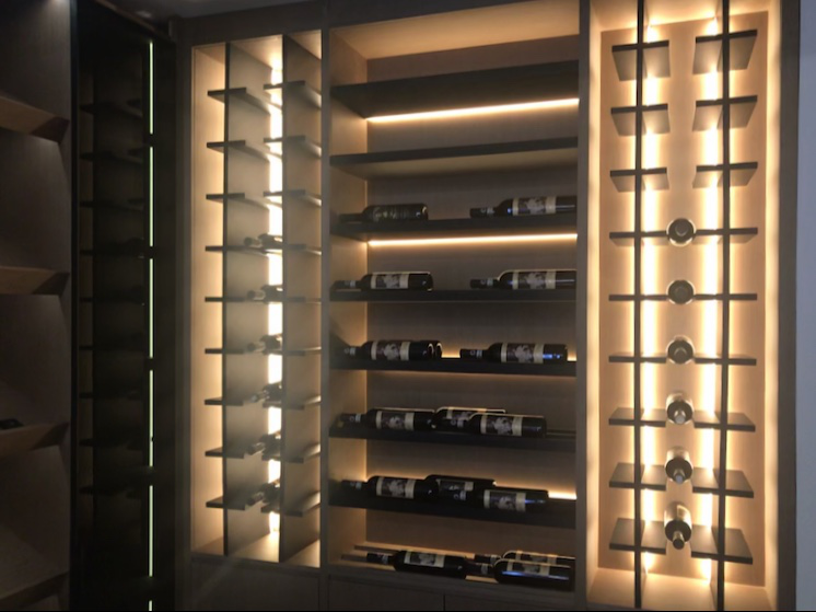 What kind of lights should be installed in the wine cabinet to create an atmosphere